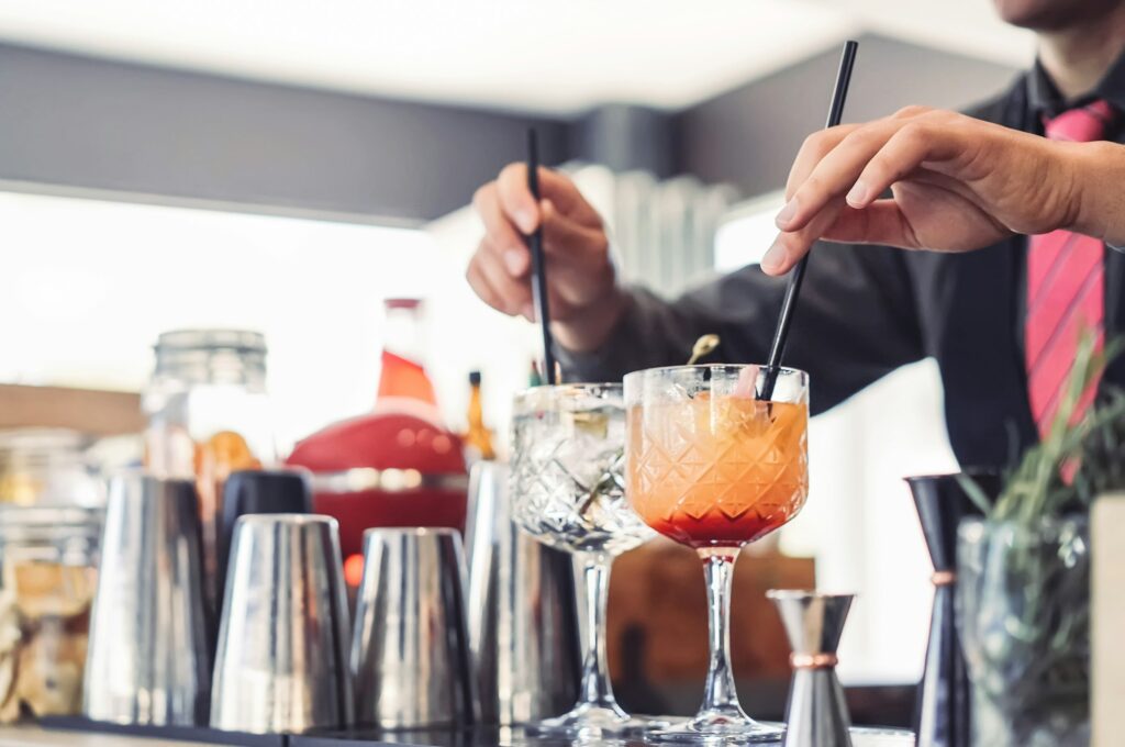 Barman preparing cocktails in entertainment bar